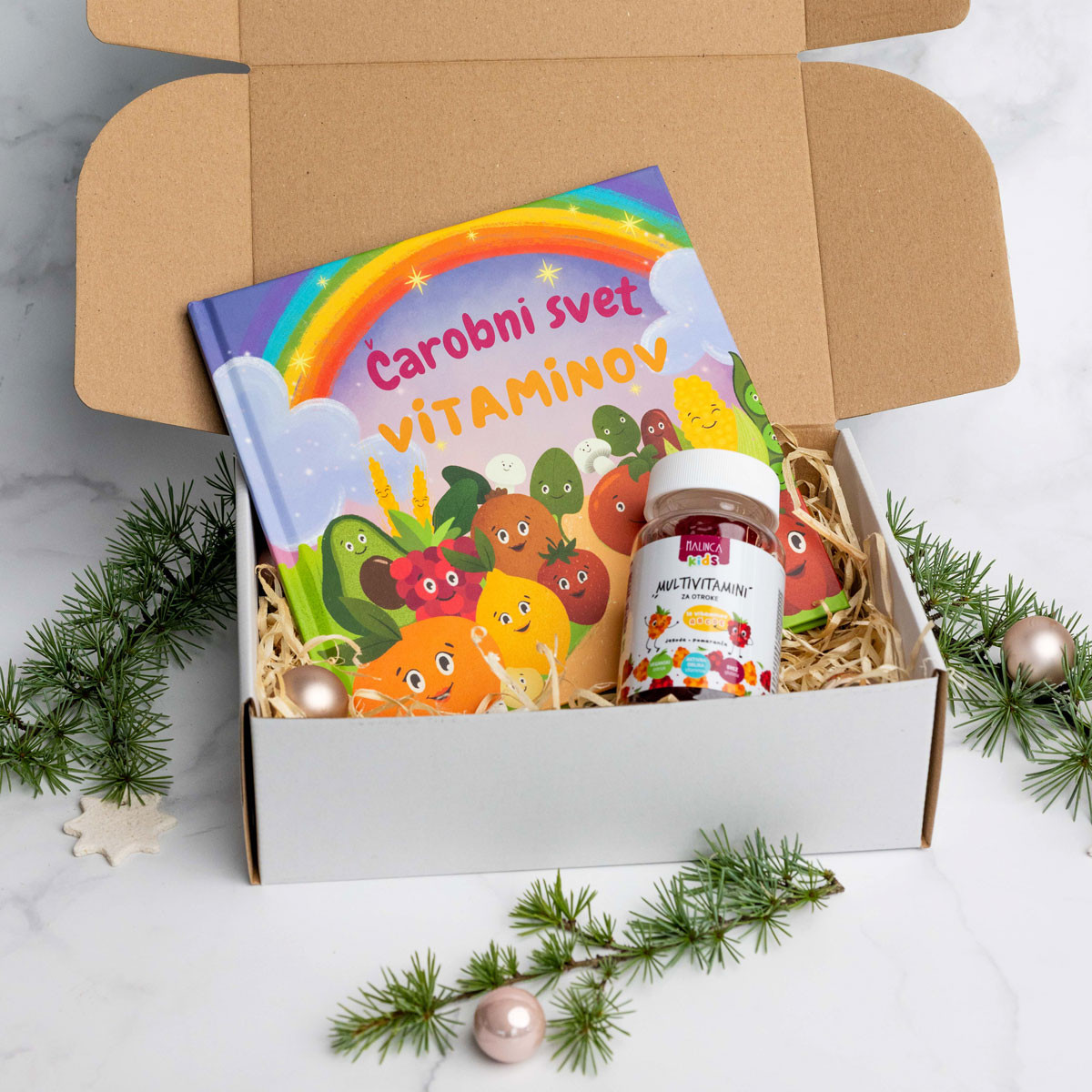 Paket multivitamini in knjiga za otroke